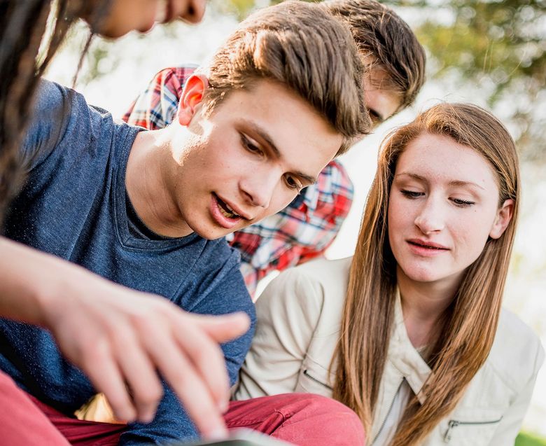 Group of college student laughing and studying togetherness