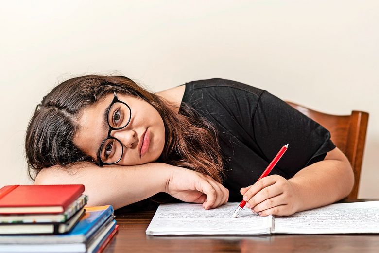 young girl tired of studying